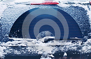 Winter frozen back car window, texture freezing ice glass