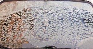 Winter frozen front window car, ice glass freeze texture background