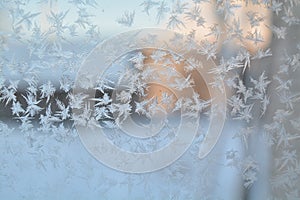 Winter frozen window snow hoar frost snowflakes glass pattern