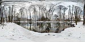 Winter full spherical hdri panorama 360 degrees angle view road in a snowy forest near river with gray pale sky in equirectangular