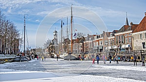 Winter fun on the canals in the city Dokkum in the Netherlands