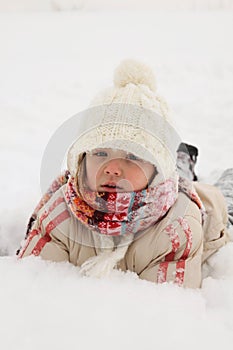 Winter Fun - Girl lying on snow