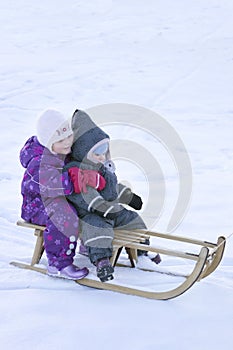 Winter fun - Kid sledging downhill