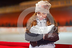 Winter fun on the rink. Portrait of a beautiful young woman standing in an ice skating rink.