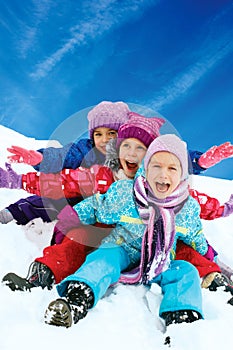 Winter fun, snow, children sledding at winter time