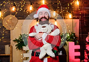Winter fundraising ideas. Charity concept. Man bearded. Santa claus play with soft toy teddy bear. Christmas charity