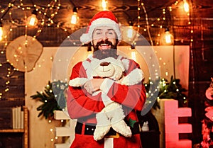 Winter fundraising ideas. Charity concept. Man bearded. Santa claus play with soft toy teddy bear. Christmas charity