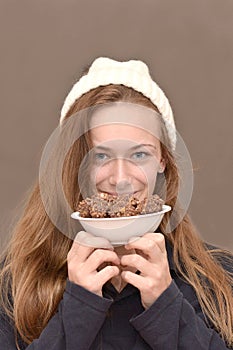 Winter girl with chocolate crunchies delight