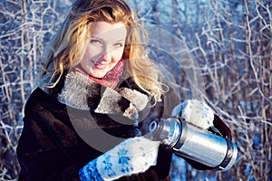 Winter girl with cup of hot chocolate