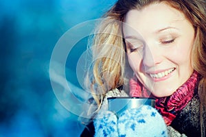 Winter girl with cup of hot chocolate