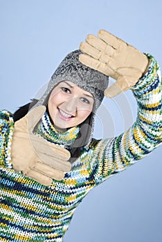 Winter girl framing face