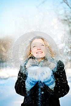 Winter girl with many snowflakes