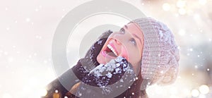 Winter girl portrait. Joyful teenage girl having fun in winter park