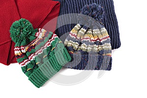 Winter hats and scarves, warm clothing, isolated on white