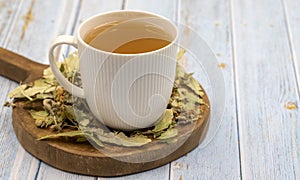 Winter herbal tea on a blue wood background. Winter tea