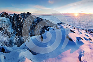 Winter High Tatras mountain range panorama with many peaks and clear sky. Sunny day on top of snowy mountains.