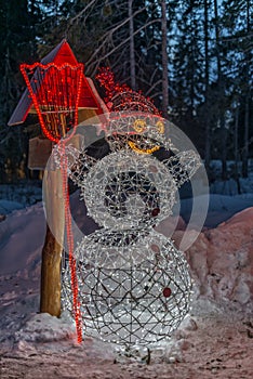 Winter in High Tatras Mountains. Illuminated snowman.