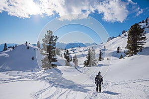Winter hiker at snowy footpath Rofan alps, sunny mountain landscape austria