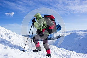 Winter hiking in the mountains .