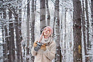 Winter hobby. Enjoy enchanting paleness and freezing atmosphere of winter. Taking stunning winter photos. Enjoy beauty