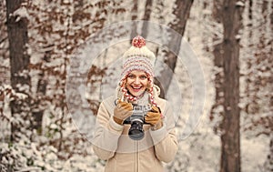 Winter hobby. Taking stunning winter photos. Enjoy beauty of snow scenery through photos. Woman photographer with