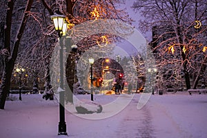 Winter holiday atmosphere in Riga park with lanterns