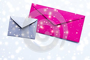 Winter holiday blank paper envelopes on marble with shiny snow flatlay background, love letter or Christmas mail card design