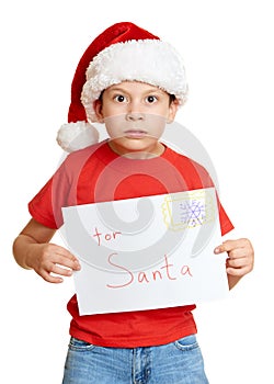 Winter holiday christmas concept - boy in hat with letter to santa on white isolated