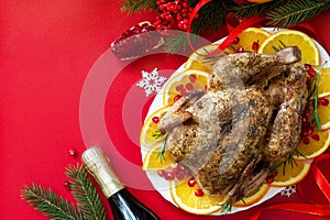Winter Holiday table Christmas dinner. Baked turkey on red background. Top view flat lay background.