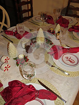 A winter holiday table set for a New Year`s Eve dinner