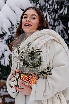 Winter holiday travel, Christmas day, New Year, beautiful happy woman portrait at snowy forest, nature woods, ski resort, leisure