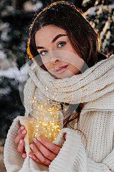 Winter holiday travel, Christmas day, New Year, beautiful happy woman portrait at snowy forest, nature woods, ski resort, leisure