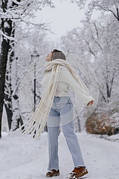 Winter holiday travel, Christmas day, New Year, beautiful happy woman portrait at snowy forest, nature woods, ski resort, leisure