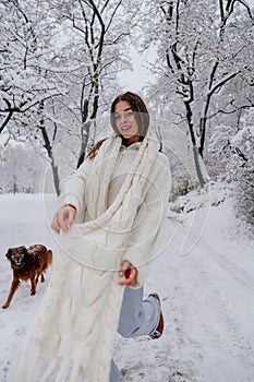Winter holiday travel, Christmas day, New Year, beautiful happy woman portrait at snowy forest, nature woods, ski resort, leisure
