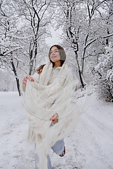 Winter holiday travel, Christmas day, New Year, beautiful happy woman portrait at snowy forest, nature woods, ski resort, leisure