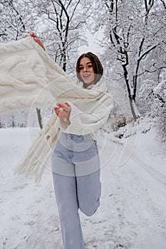 Winter holiday travel, Christmas day, New Year, beautiful happy woman portrait at snowy forest, nature woods, ski resort, leisure