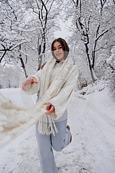 Winter holiday travel, Christmas day, New Year, beautiful happy woman portrait at snowy forest, nature woods, ski resort, leisure