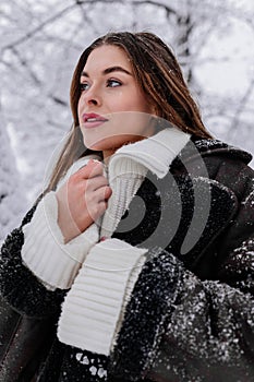 Winter holiday travel, Christmas day, New Year, beautiful happy woman portrait at snowy forest, nature woods, ski resort, leisure