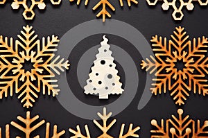 Winter holidays background with handmade wooden elements