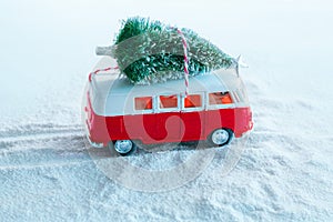 winter holidays greeting card christmas tree on retro toy truck in snowy forest