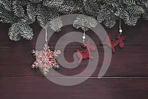 Winter holidays ornaments, christmas background with spruce twigs border, deers and snowflake decorations