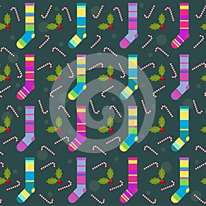 Winter holidays pattern background with colorful baby socks for