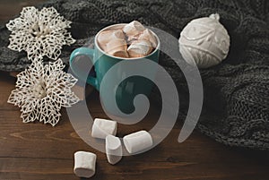 Winter home background - cup of hot cocoa Christmas ball and s