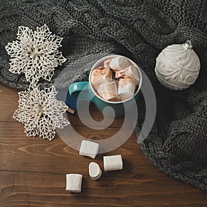 winter home background - cup of hot cocoa Christmas ball and snowflakes
