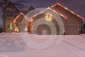Winter Home with Holiday Lights and Tracks