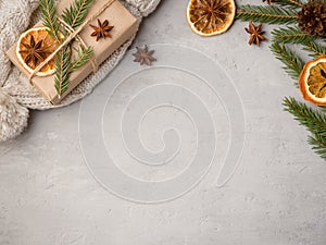 Winter hot chocolate drink in a Cup on a gray concrete background tangerines festive decorations Copy space