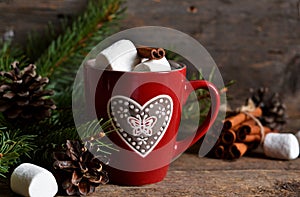 Winter hot drink-hot chocolate with marshmallows in a red bowl