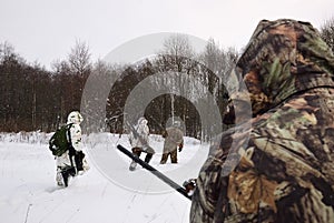 Winter hunting in woods photo