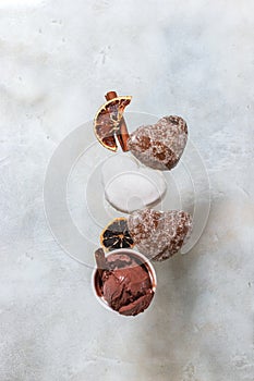 Winter ice cream with gingerbread cookies. Gingerbread cookies and ice cream fall or fly in motion