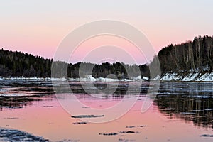 winter ice drift river at sunset